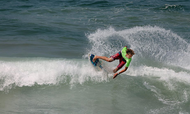 A man skimboarding